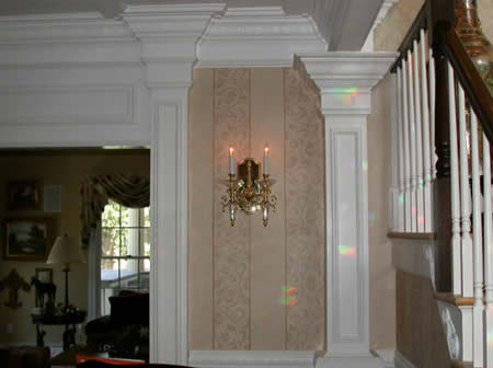 Artful moulding installation, patterned handdone wall finish