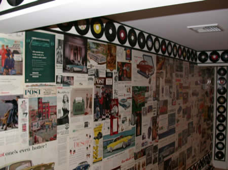 Collage wall of vintage records and Saturday Evening Post advertisements.Quogue, NY