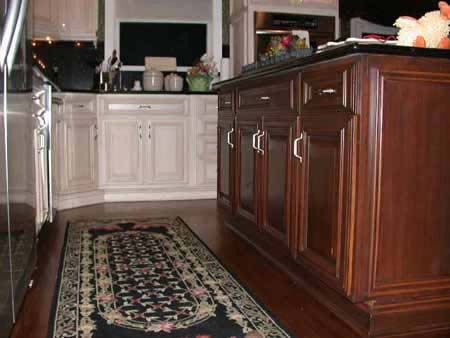 Kitchen changed from light maple with no detail to elegant  glazed cabinets and a stained island with new hardware and added mouldings. Smithown, NY