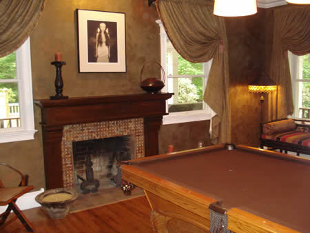 Custom mantle made from oak tree on client property. Custom wall finish.