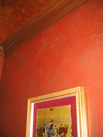 Textured wall finish, copper leaf ceiling, crown moulding.