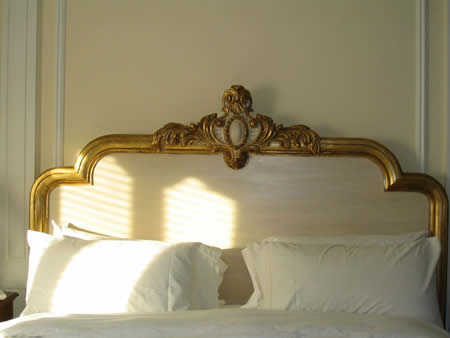 Gold trimmed headboard.